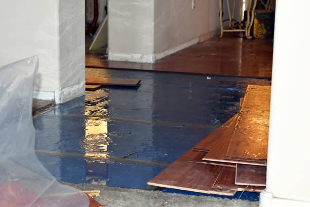 Professional Flood Damage Restoration technician working in Bancroft, WI